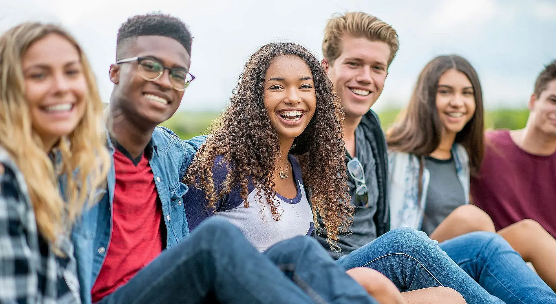 Six young adults sit together outdoors, smiling show easy Invisalign payment plans at Orthodontic Design Co. Orthodontics in Madison and Huntsville, AL. Six young adults sit together outdoors, smiling show easy Invisalign payment plans at Orthodontic Design Co. Orthodontics in Madison and Huntsville, AL.